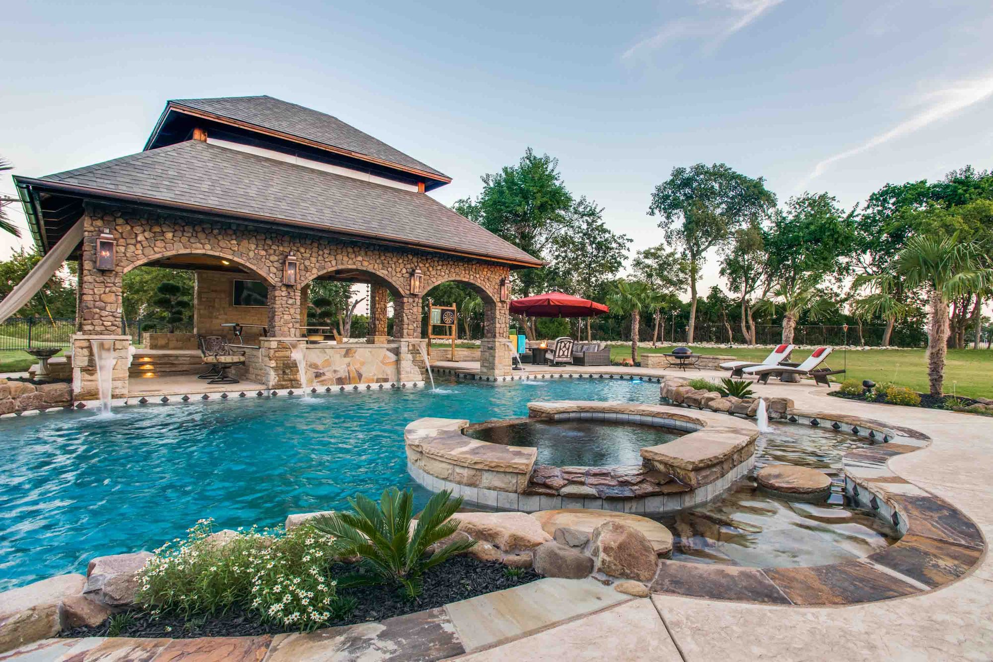 backyard pool with hot tub